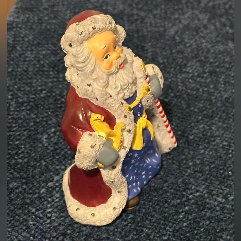 Small Santa with stars on his robe by Lenox’s Collectors Treasury of Santa’s.